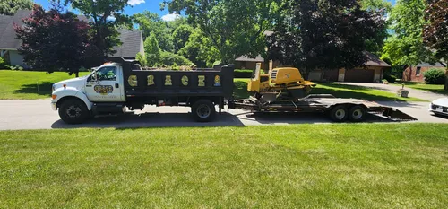 Grace Tree Service dump truck and equipment trailer
