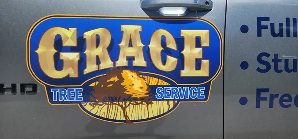 Close-up of the Grace Tree Service logo on one of our trucks